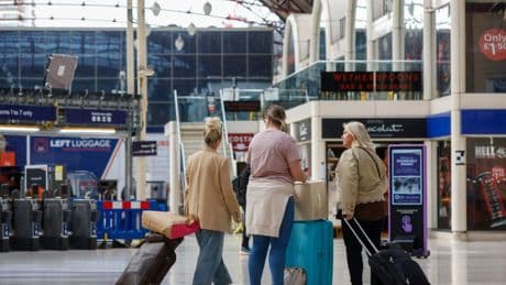 Two-hour queues and ‘do not travel’ warning as strikes hit bank holiday travel
