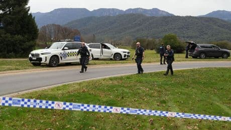 Manhunt after two police officers shot dead and third seriously injured in Australia