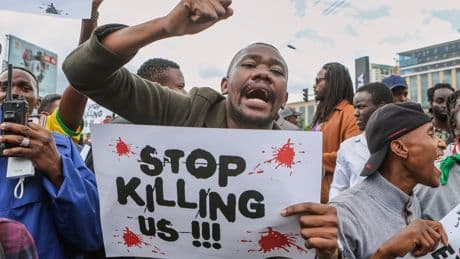 Police tear gas activists protesting the death in police custody of a Kenyan blogger