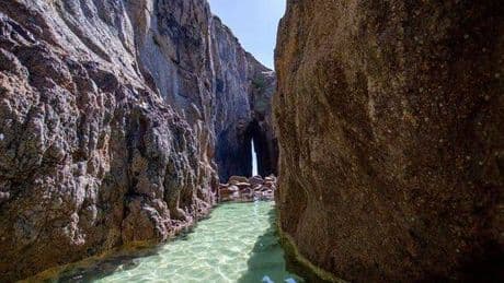 Little-known beach with azure water and magical arch unlike anything else
