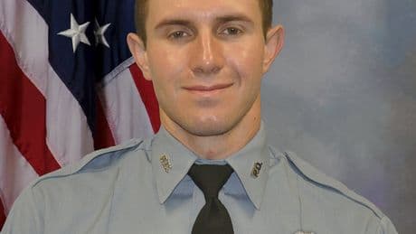 A Kansas City, Kansas, police officer has died after being struck by a fleeing driver