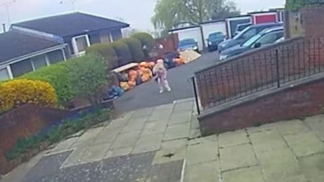 Moment woman is ATTACKED by dive-bombing buzzard terrorising town as primary school bans kids playing outside