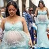 Pregnant Rihanna shows off her growing baby bump in a mesh gown as she attends global premiere of highly-anticipated Smurfs movie in Brussels
