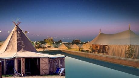 Inside the £28,999 Glastonbury accommodation with pools, an onsite hairdresser, and helicopter arrivals