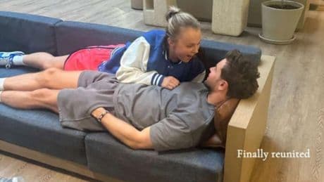 JoJo Siwa lies on top of Chris Hughes after ‘finally reuniting’ on holiday