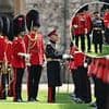 King Charles is dwarfed by troops as he inspects them ahead of birthday parade