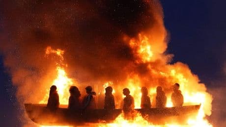 Life-size mannequins in migrant boat burn on Northern Ireland bonfire