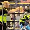 Moment 'thief' is pepper sprayed by police after smashing bottles as he tried to flee Tesco supermarket