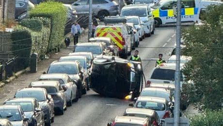 Car flips onto side on Glasgow street after multi-vehicle smash as man charged