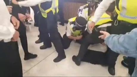 Police officer ‘punched in face’ during clashes with anti-migrant mob