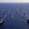 Britain and America's show of strength to China: UK and US aircraft carriers steam through Pacific in display of combined military might amid mounting tensions with Beijing