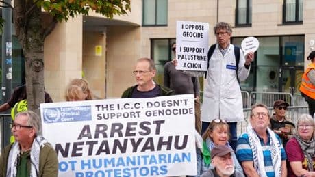 Palestine activists and anti-immigration protestors gather outside Holyrood
