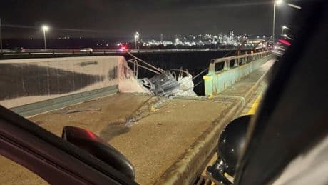 Lorry cab plunges off bridge and leaves driver missing