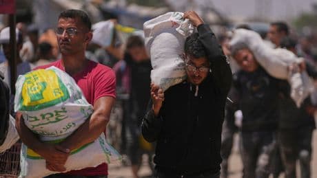 An Israeli strike kills 18 Palestinians in central Gaza as turmoil mounts over food distribution