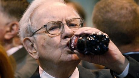 Warren Buffett defends his love of Coke and lack of exercise, noting that he's still here at 94