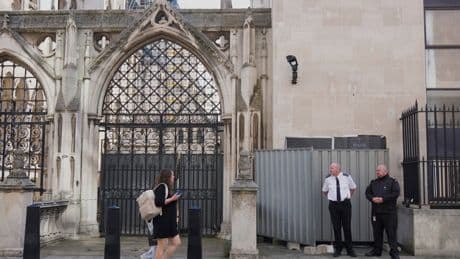 Banksy unveils a new mural of a judge beating a protester outside London court