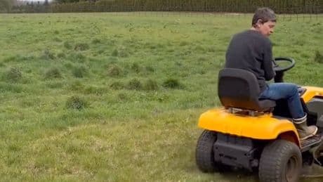 Ellen DeGeneres shows off new look in the Cotswolds as she mows lawn at her sprawling estate