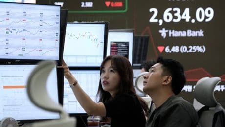 Asian shares are mostly lower after a mixed session on Wall Street