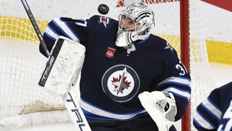 ‘Shocked’: Winnipeg Jets goalie Connor Hellebuyck wins both Hart, Vezina trophies