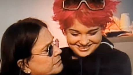 Kelly Osbourne shares heartbreaking video sat in arms of dad Ozzy