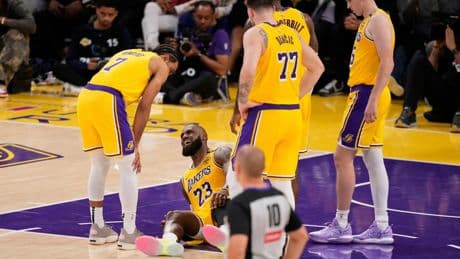 LeBron James sprained a knee ligament in Lakers' final loss to Wolves, an AP source says