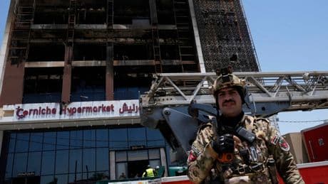 Officials try to identify 18 bodies in deadly Iraq shopping mall fire