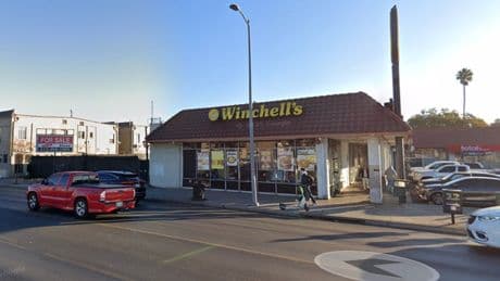 An armed man dressed in a bikini storms a donut shop – but staff fight back