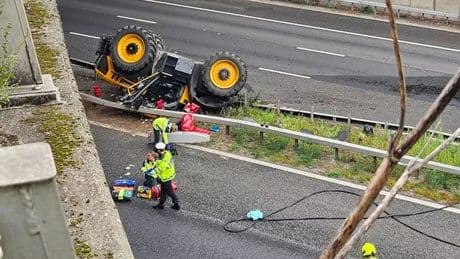 Tractor falls from bridge in horror M20 crash as man airlifted to hospital