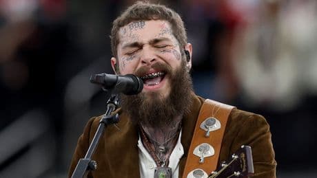 Post Malone falls off stage while trying to toast fan