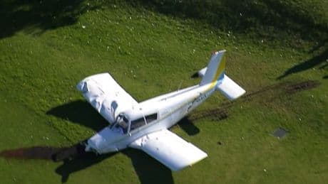 Plane crash lands on golf course with 'bang' after passing over players