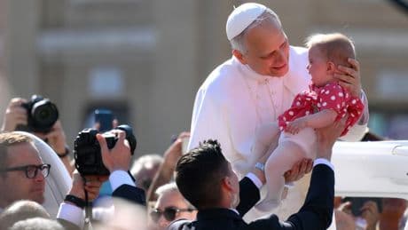 Pope Leo holds baby & waves to crowds in St Peter’s Square as world leaders gather for Pontiff’s inauguration mass