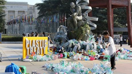 Artist drowns sculpture in plastic waste in front of the UN during plastic pollution treaty talks