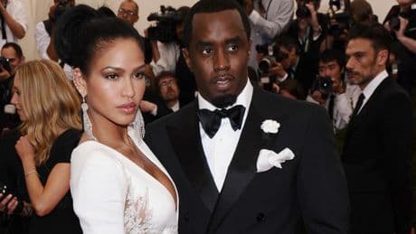 A former aide says Sean 'Diddy' Combs kidnapped her in a plot to kill Kid Cudi