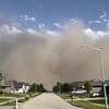 Apocalyptic 'wall of dust' engulfs Chicago as at least 23 are killed and half a million are without power in tornado hellscape