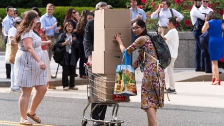 Photos of US State Department workers getting hugs and applause as they're fired