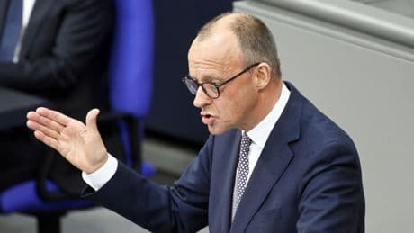 Germany finally appoints Friedrich Merz as chancellor in second round of voting after day of chaos in Berlin
