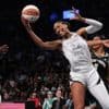New York wins opener against Las Vegas 92-78 after celebrating 2024 title with ring, banner ceremony