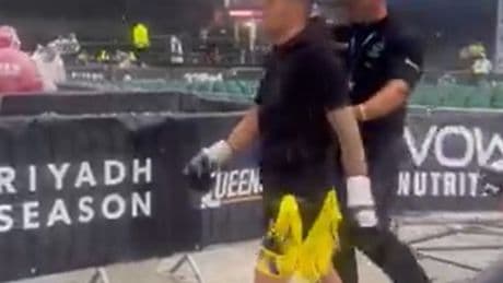 Boxer Sam Gilley walks to the ring with an UMBRELLA as rain pours down at Fabio Wardley’s Portman Road fight