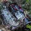Horror bus crash kills 21: Overcrowded bus 'carrying Buddhist pilgrims' plummets off cliff in Sri Lanka