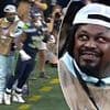 NFL legend Marshawn Lynch throws an elbow at a player while working as a photographer at Seahawks game