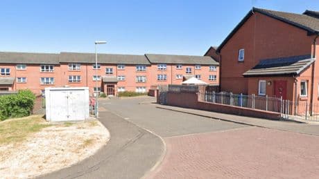 Man charged after 'cocaine and replica weapons' found during raid on Glasgow home