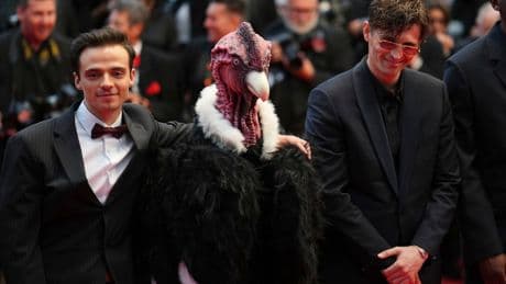 Bird man on red carpet leaves Cannes squawking