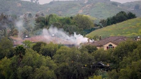 Pilot killed as small plane crashes into homes in California