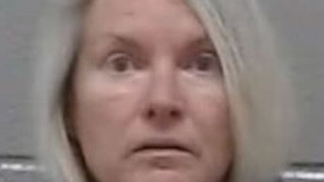Woman 'shot husband and dragged body out of house with a tractor'