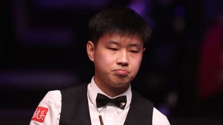 What is on Zhao Xintong’s bow tie? Chimchar is gracing the Crucible final