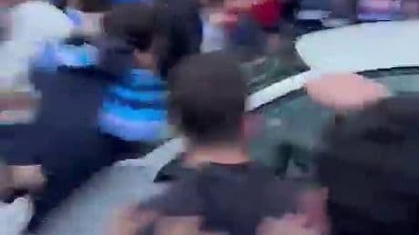 Shocking moment a car ploughs into huge crowd of football fans near stadium before Barcelona derby clash