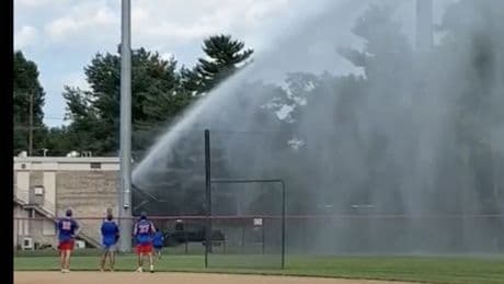 Peeved firefighter floods baseball field with fire hose after ball hits his truck, ending game
