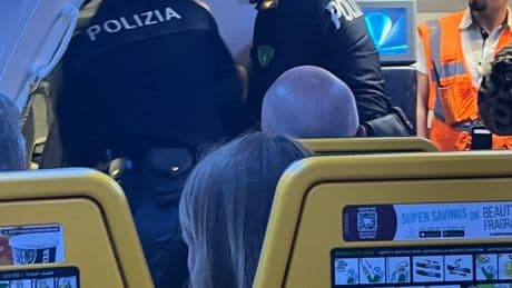 Moment Brit passenger is dragged off Ryanair flight to Corfu after ‘on-board brawl’ diverted plane 600 miles to Italy