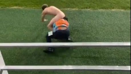 Shocking moment security guard wrestles streaker and ends up with idiot’s BUM in his face