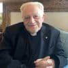 Monseigneur Karel Kasteel kan de zwarte rook vanaf zijn dak zien